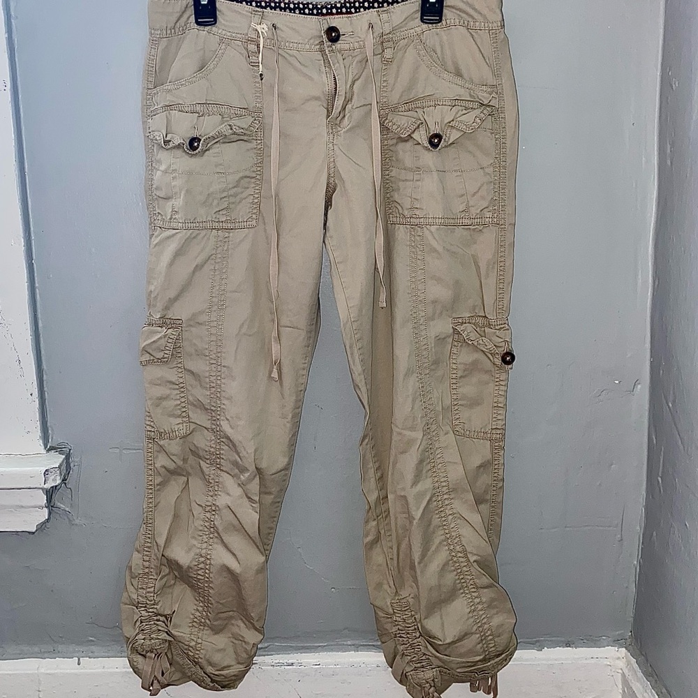 Tan cargo pants with adjustable waist and ankles